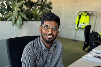 Estimator Saikrishna at his desk in the office