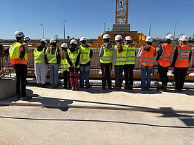 Children wearing high-visibility clothing on the Kriegenbrunn lock construction site