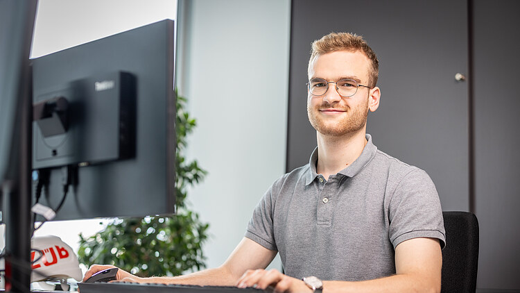 An employee at a desk
