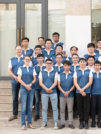 Gruppenfoto vietnamesischer Mitarbeiter:innen