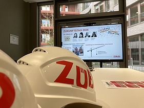 A ZÜBLIN helmet, with a presentation in the background