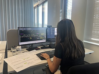 Anh Thu working on a project at her desk