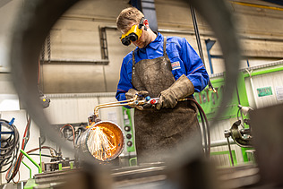 Apprentice carrying out soldering work