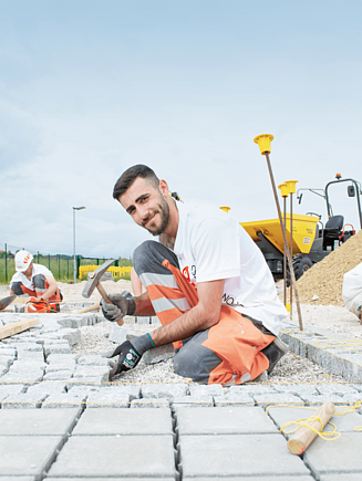A paver lays stones