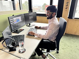 Saikrishna working on a project at his desk