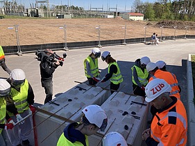 Children wearing high-visibility clothing on the Kriegenbrunn lock construction site
