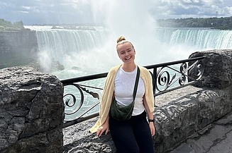 Trainee Anne laughing in front of Niagara Falls
