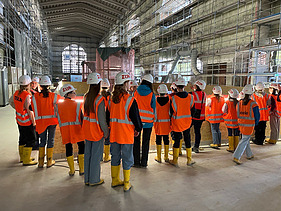 Children wearing high-visibility clothing at the S21 construction site
