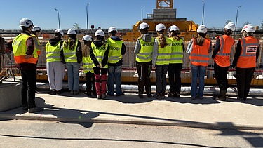 Children wearing high-visibility clothing on the Kriegenbrunn lock construction site