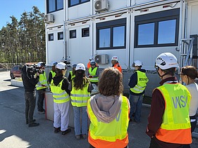 Children wearing high-visibility clothing on the Kriegenbrunn lock construction site